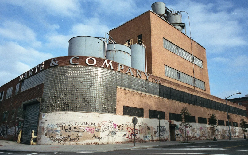 an old rundown building with graffiti all over it