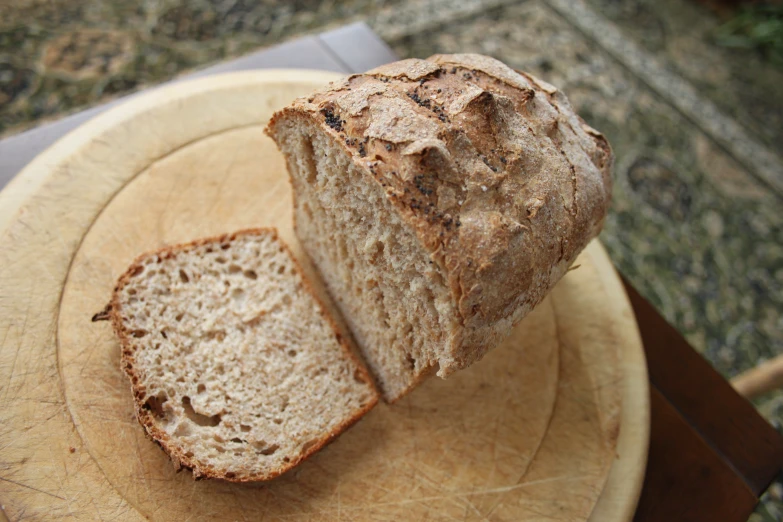 a sliced loaf of bread sits on a table