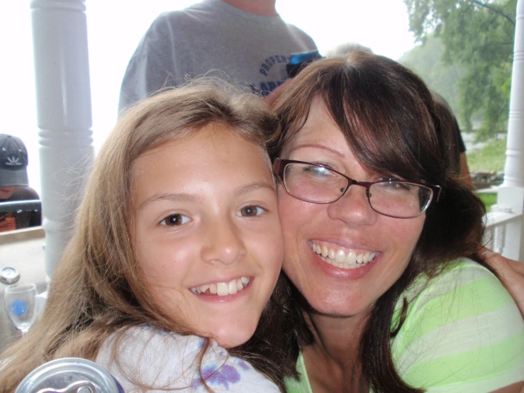 a mother and daughter are posing for a pograph