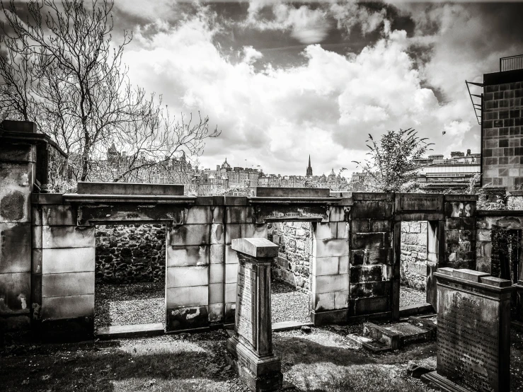 a graveyard on a cloudy day in a black and white po