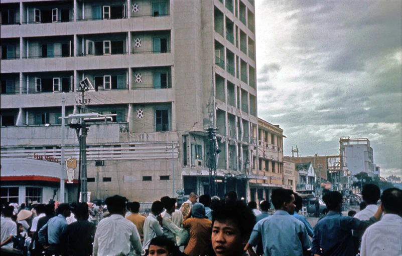 a group of people are gathered around outside