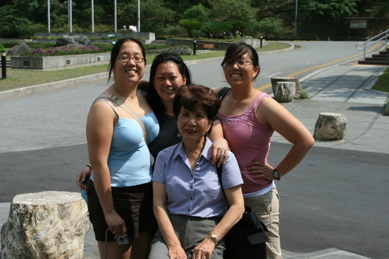 a group of women standing together in the street