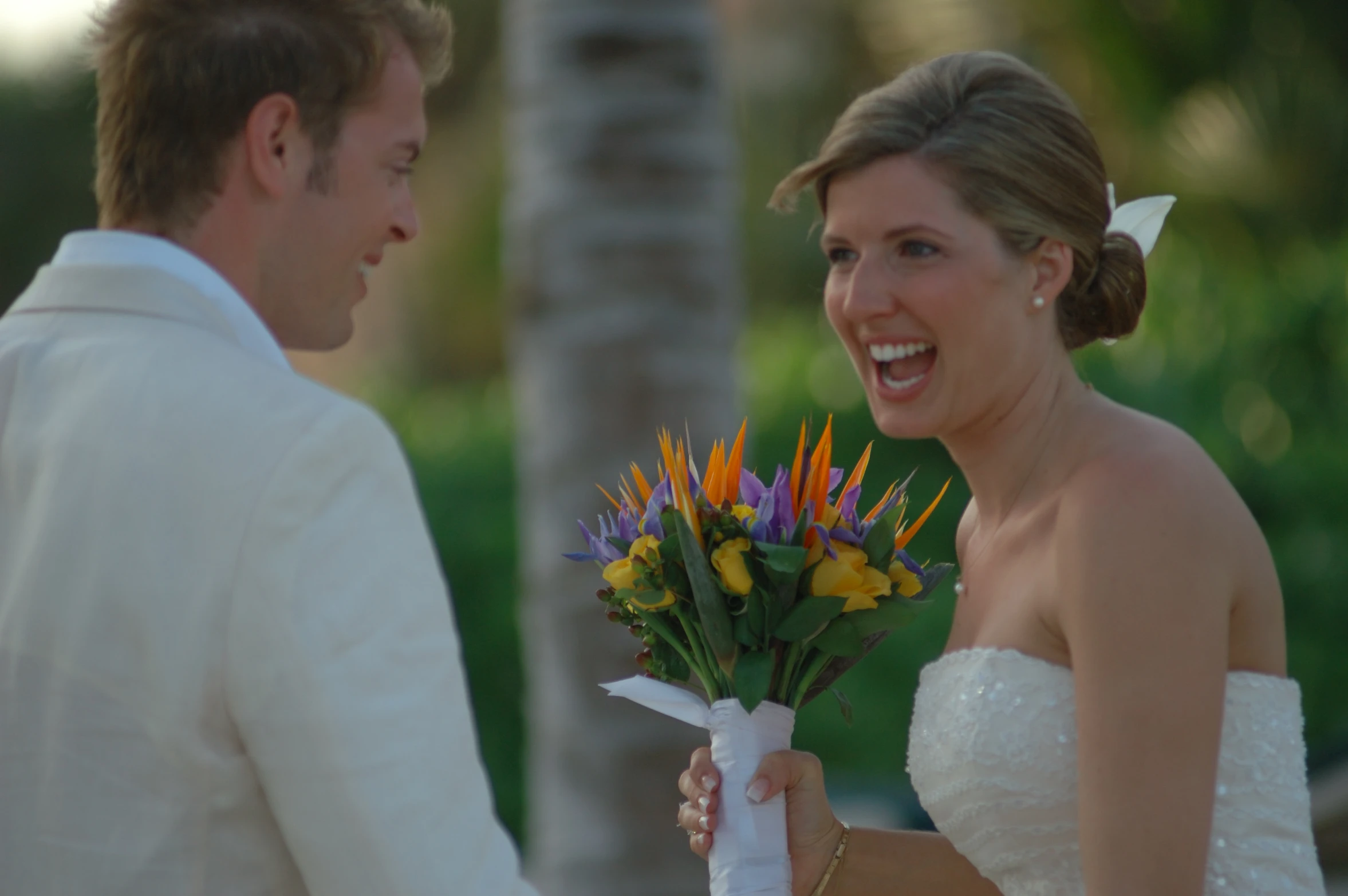 the bride and groom look at each other as they exchange wedding vows