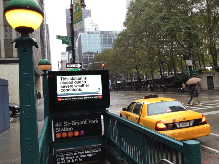 a picture of a taxi parked at a bus stop