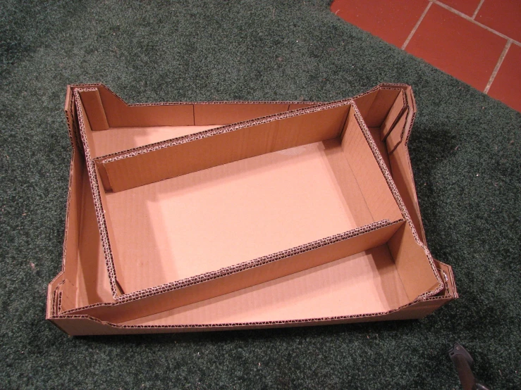 an open box sitting on top of the floor