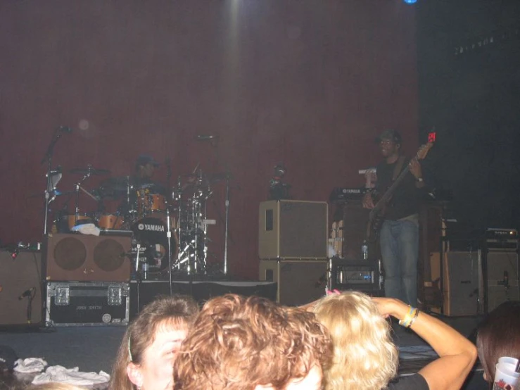 a group of people standing on top of a stage