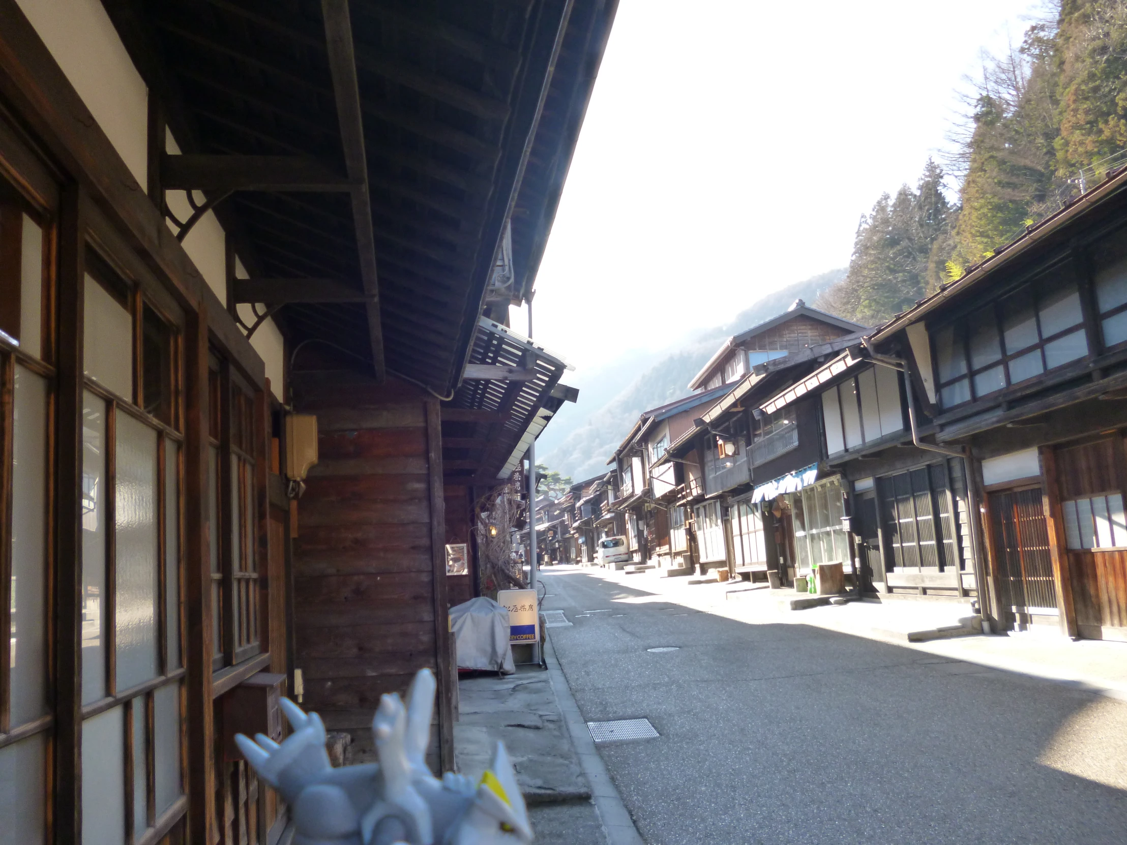 an old town with some shops in the middle