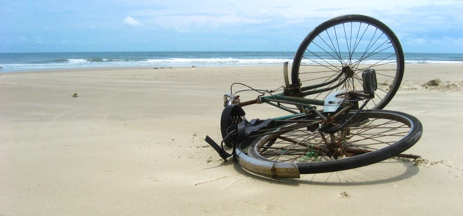 there is a bicycle that is on the beach