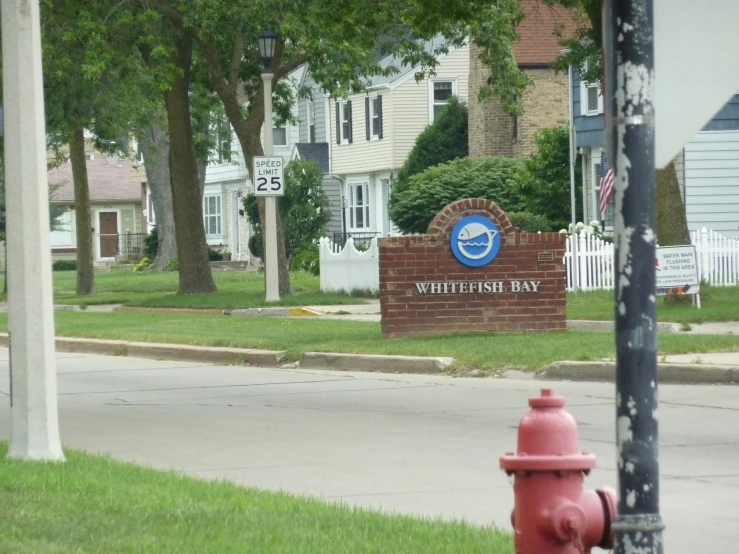 a sign for the whitland way on a residential street