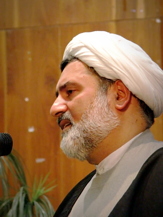 a man wearing a turban and looking off to the side