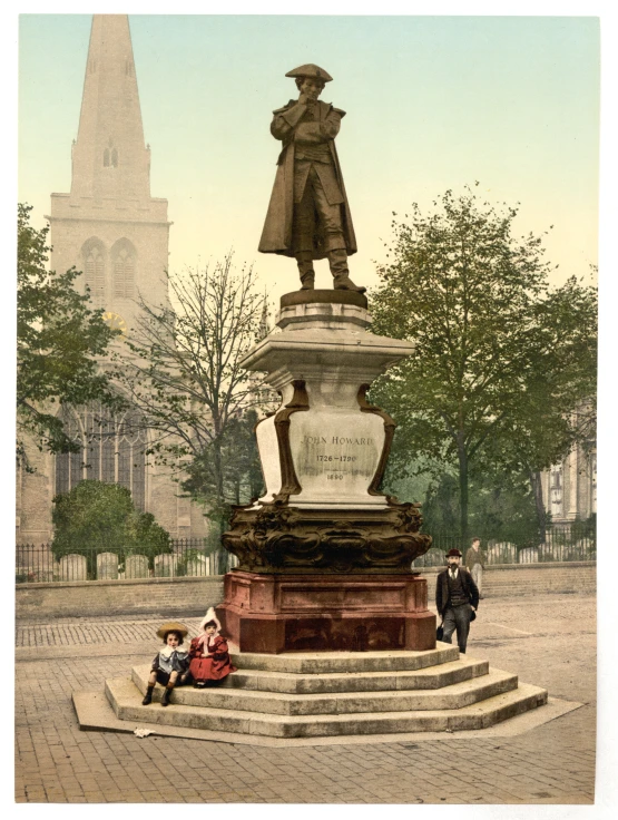 a small statue is on a stone step near steps and people