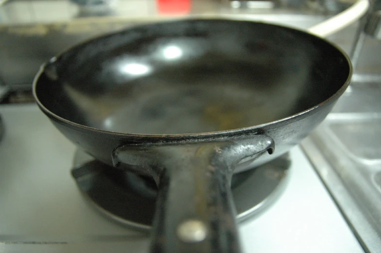 an old frying pan sitting on top of a stove