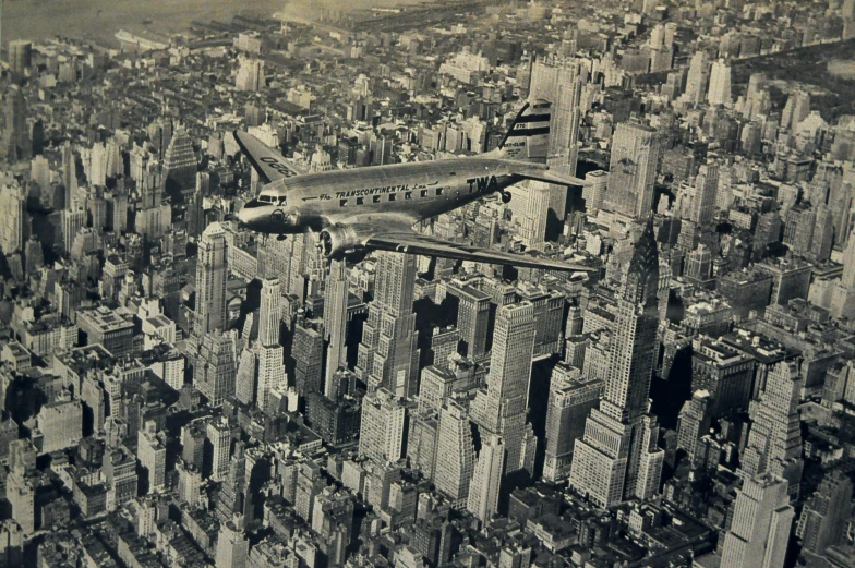 an airplane flying over a city in a vintage po