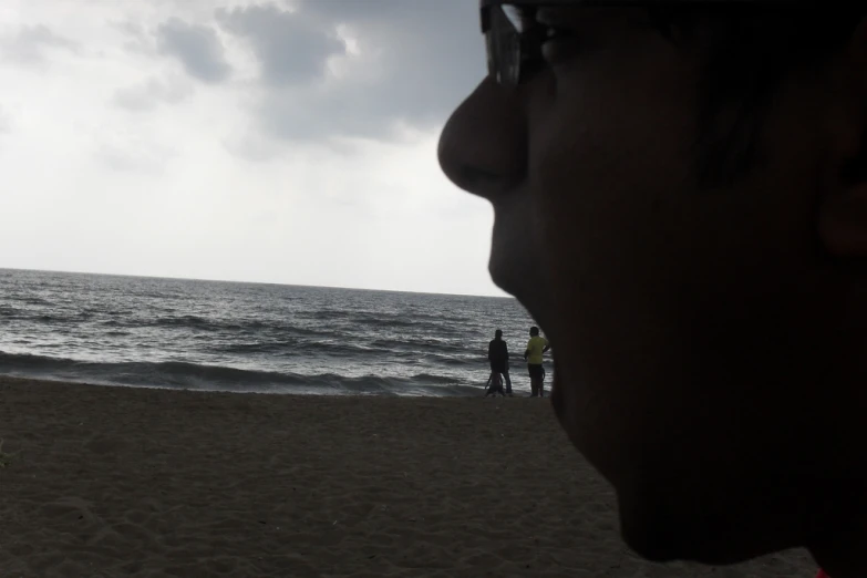 man looking out at a distant body of water