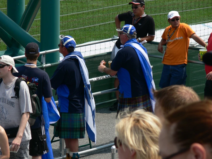 a group of people that are standing in a row