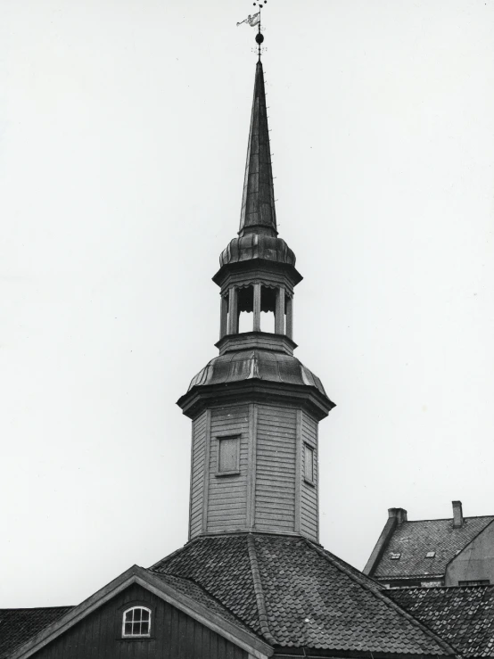 a tall tower with a small pointed roof