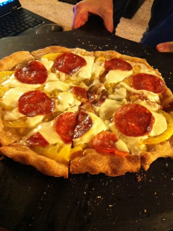 a pizza with toppings is sitting on a table