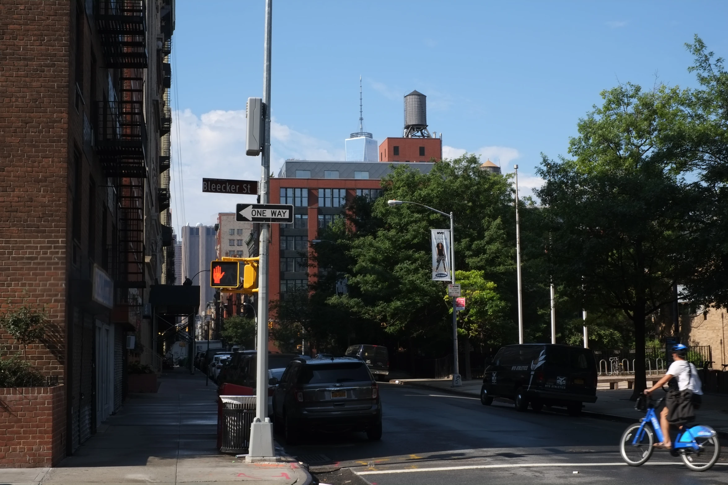 a person rides a bicycle on a city street