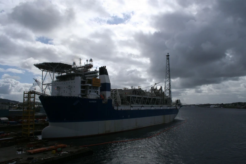 the large blue and white boat is in the water