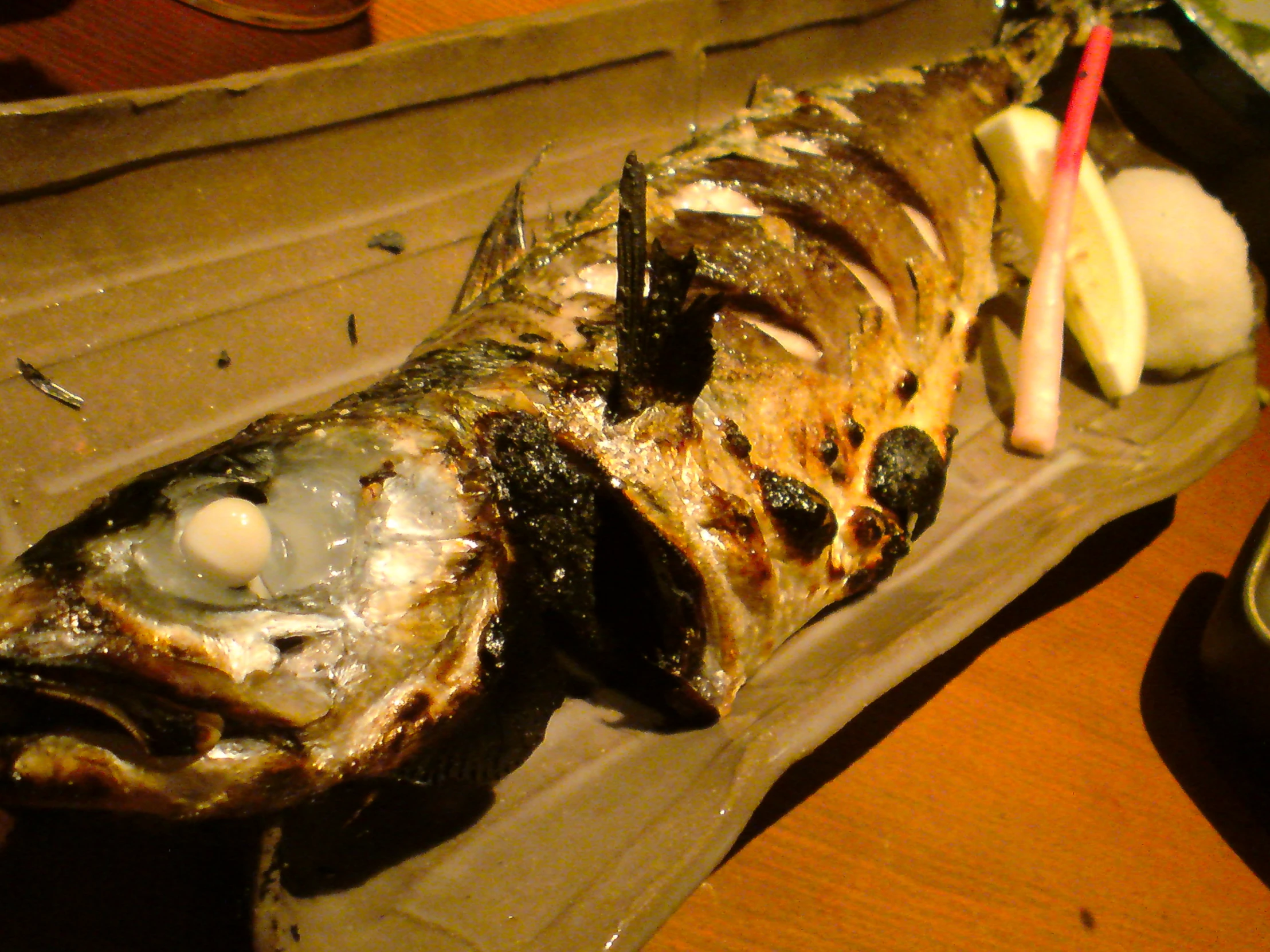 the side of an opened oyster is on the table