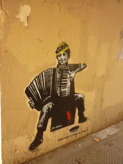 a painting of a man in traditional clothes is spray painted on the wall