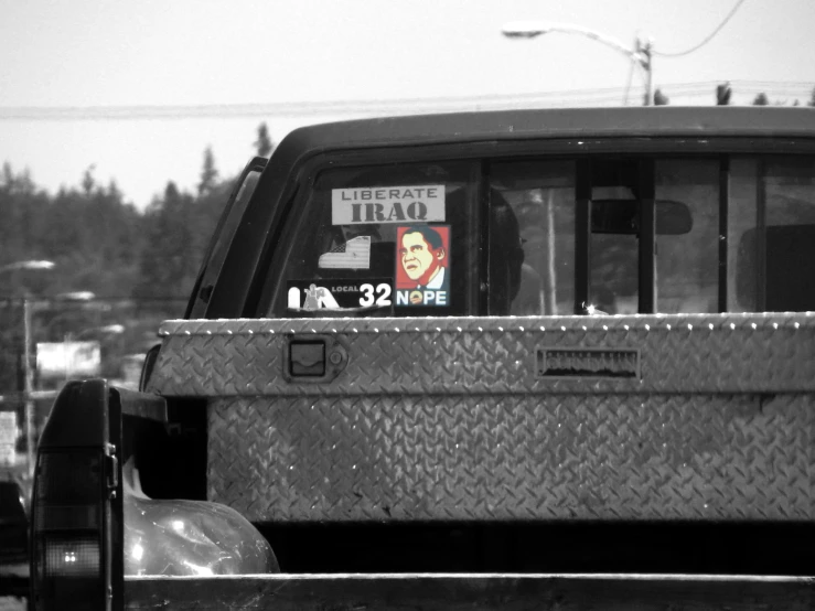 a truck that has some signs in the back