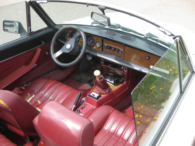 view from above of a car with leather seats and dashboard