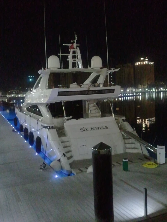 the big white boat is parked on the pier