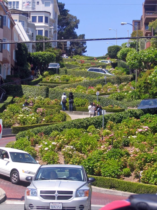 a hillside that is part of the town, with people in it