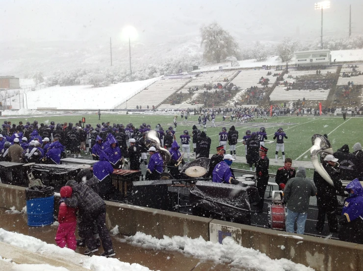 a band is playing on a snowy day