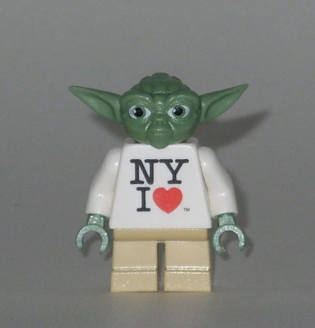 a toy of yoda with a love shirt and a heart on it