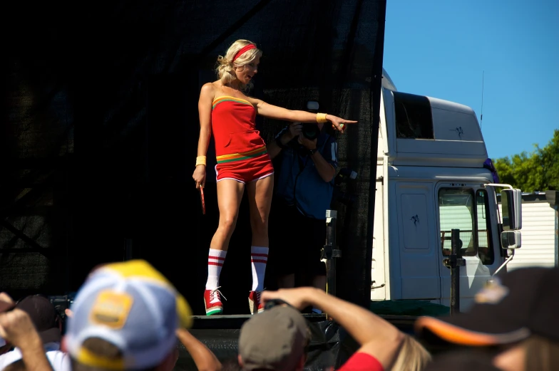 woman in short skirt on stage at festival