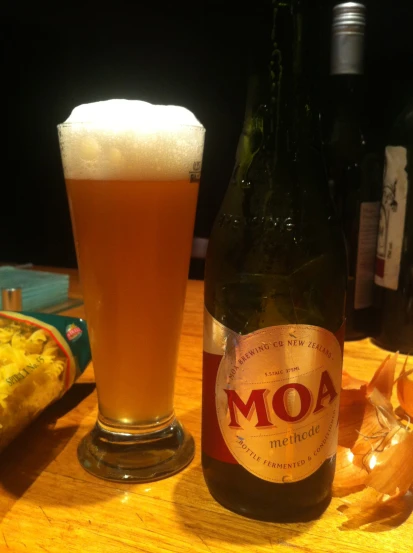 a bottle of moha beer next to some food