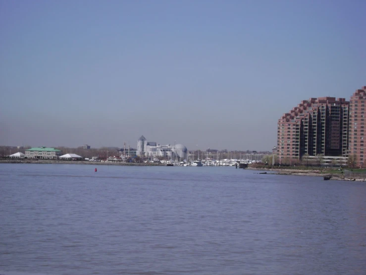 an image of a harbor with sailboats in the water