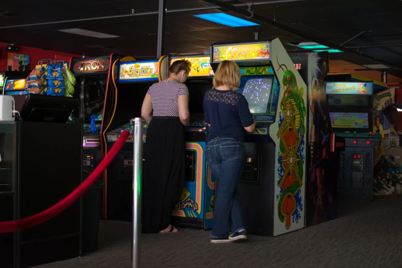 two women are playing the same game in a carnival
