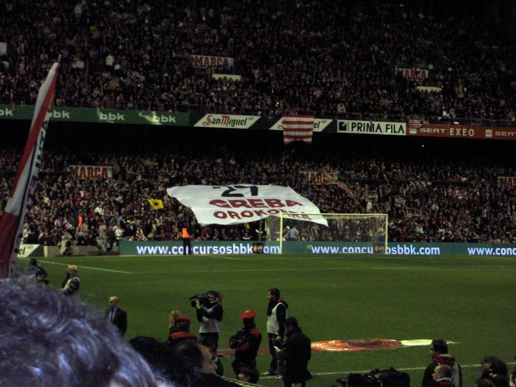 a stadium full of people with soccer banners