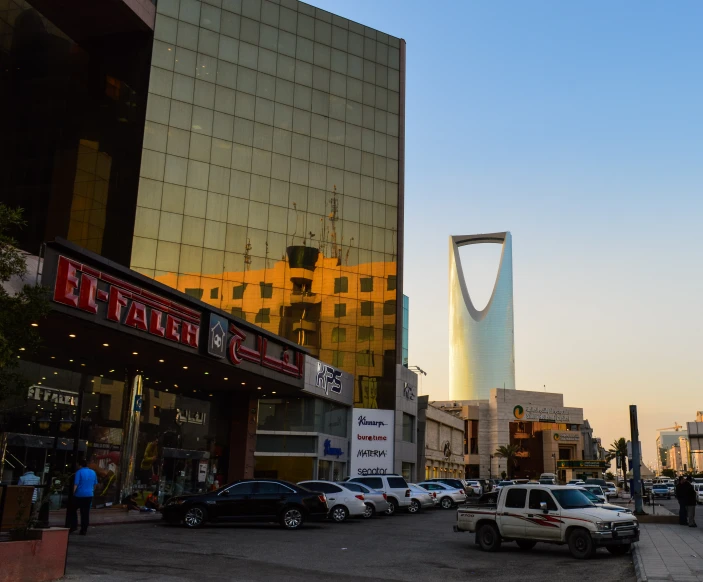 a busy street in a city with tall buildings