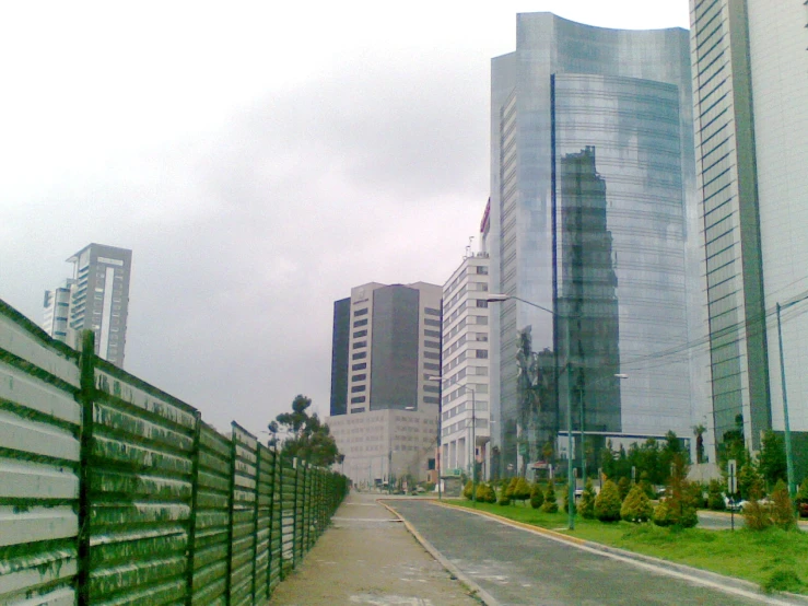 a street view of a city with tall buildings