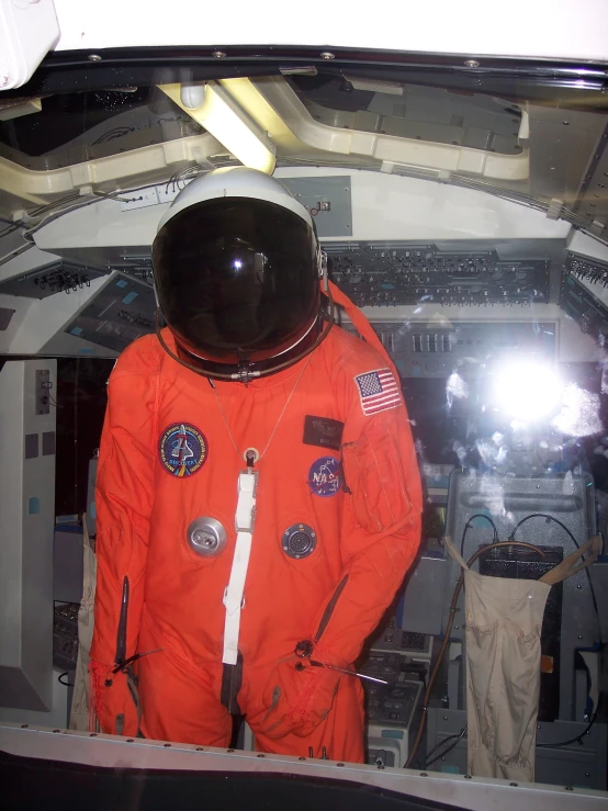 a man in a space suit is standing inside