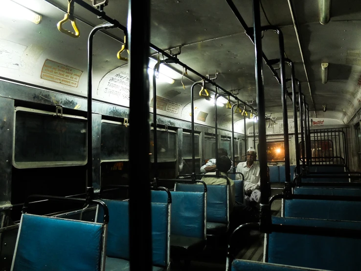 the seats of the train are empty and blue