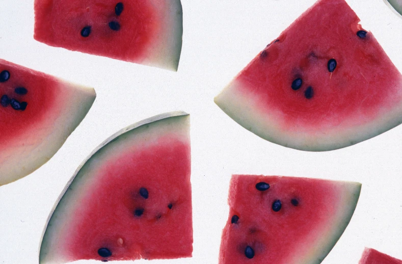 a slice of red watermelon with a bite taken out of it