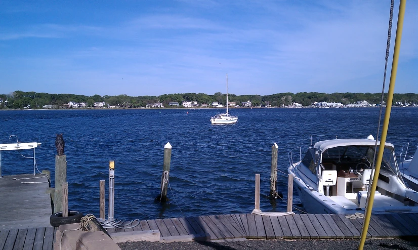 a boat sits in the water as it passes by