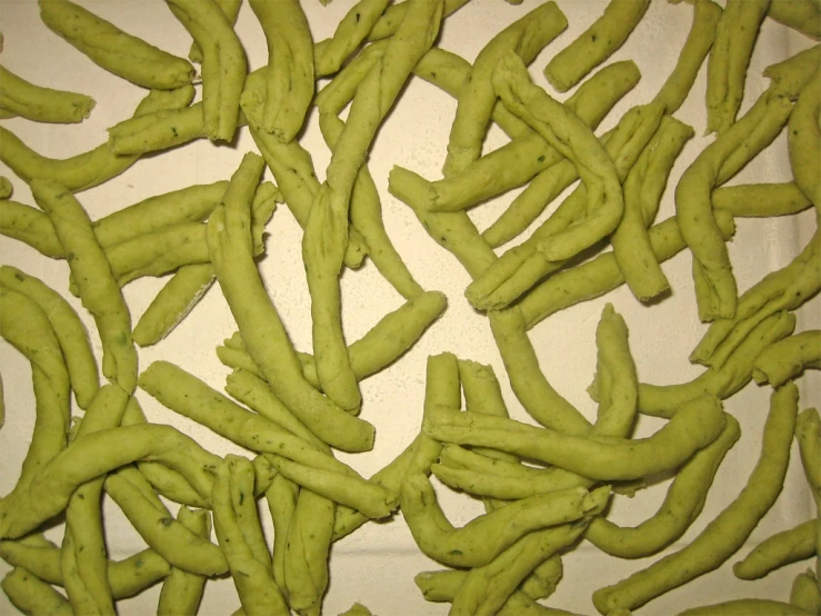 a table with a white plate with green beans