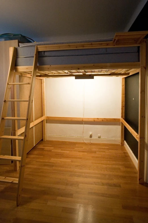 a loft with a ladder and a ladder up to the ceiling