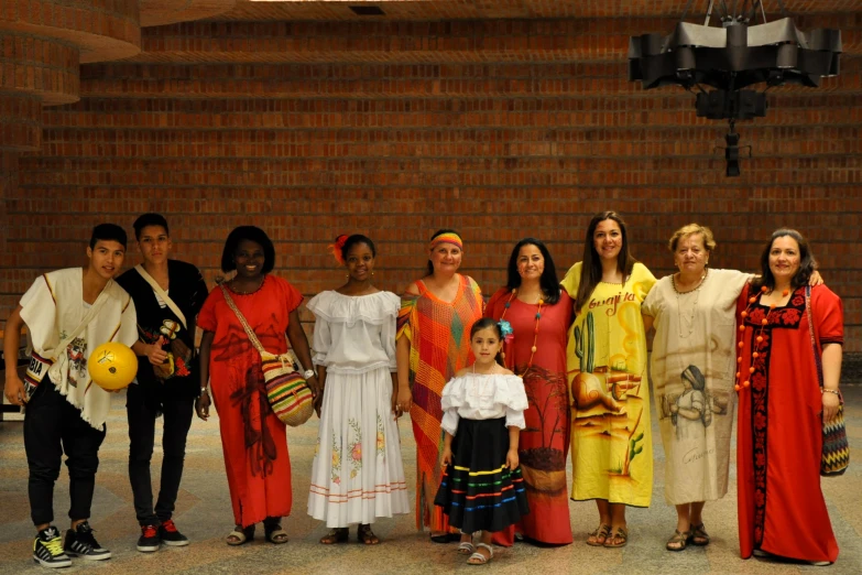 a large group of people in costume standing near a building