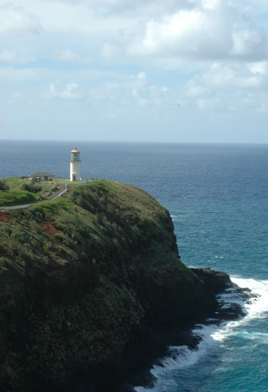 a large body of water with a lighthouse on top