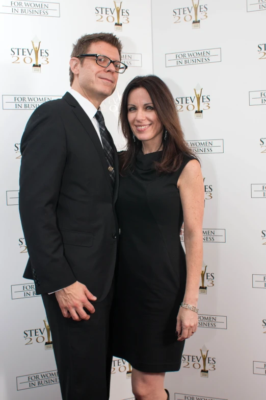 a couple is posing together on the red carpet