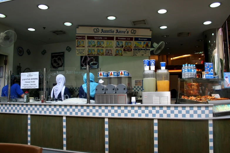 a food counter with drinks on it