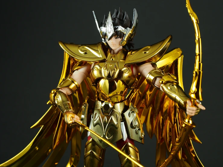 a toy figure with an angel wings and metal hair