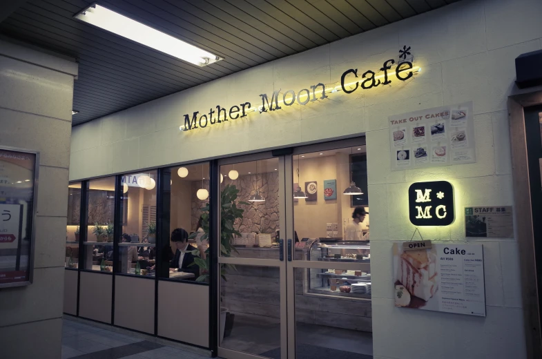 a restaurant front with signs in the windows